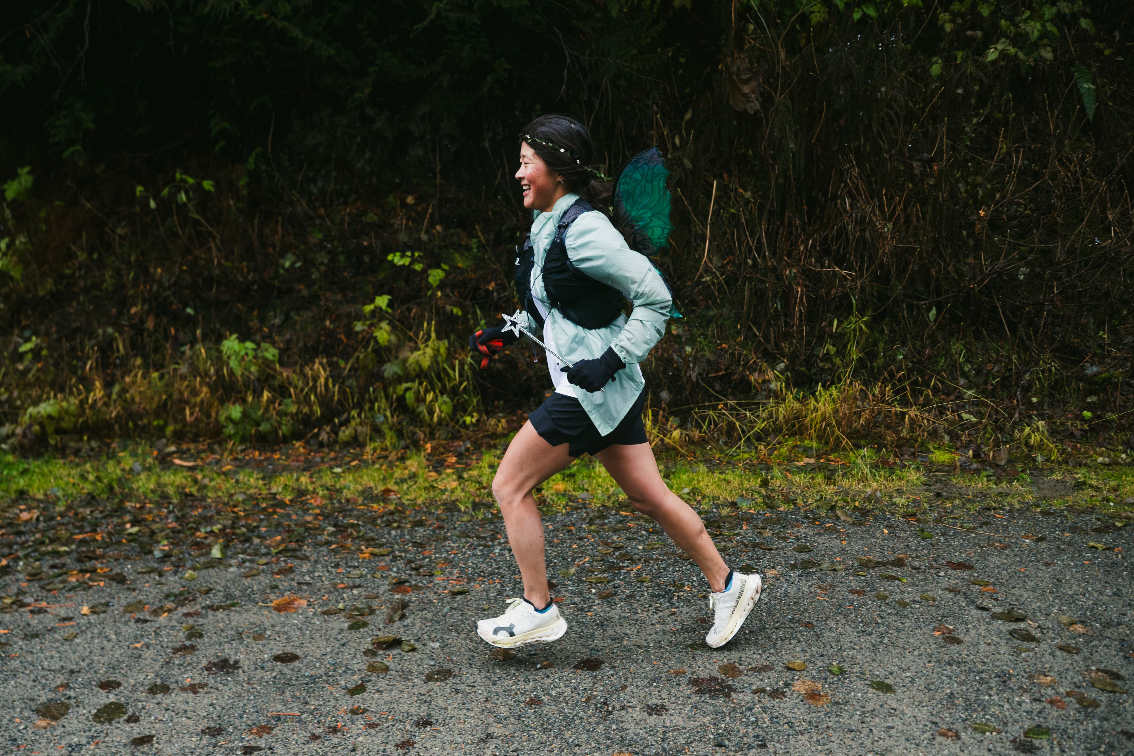 Trail runners in golden autumn light on the Palouse to Cascades Trail